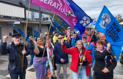 Dozens of people protest in a rally in Newcastle to oppose the threat to workers compensation for mental health injuries.