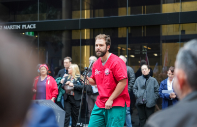 A Doctors Union member gives a speech during the rally in Sydney to oppose the threat to workers compensation in NSW.